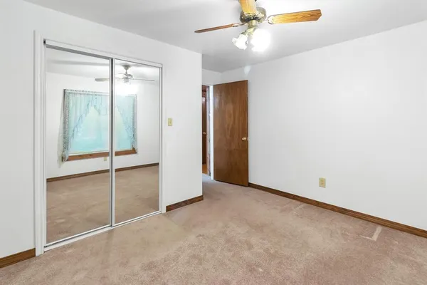 an empty room with fan