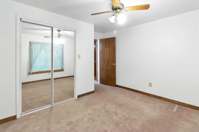 an empty room with fan