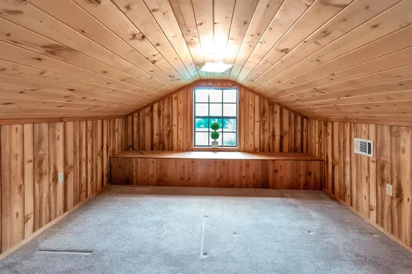a view of a room with large windows