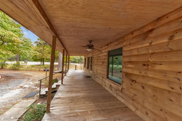 a view of a patio with wooden floor