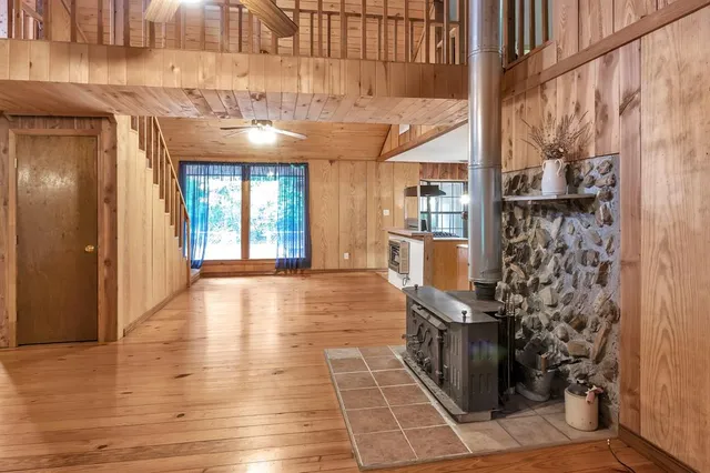 a view of an entryway with wooden floor