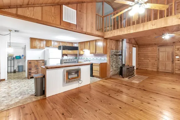 a kitchen with stainless steel appliances granite countertop a sink a stove and cabinets