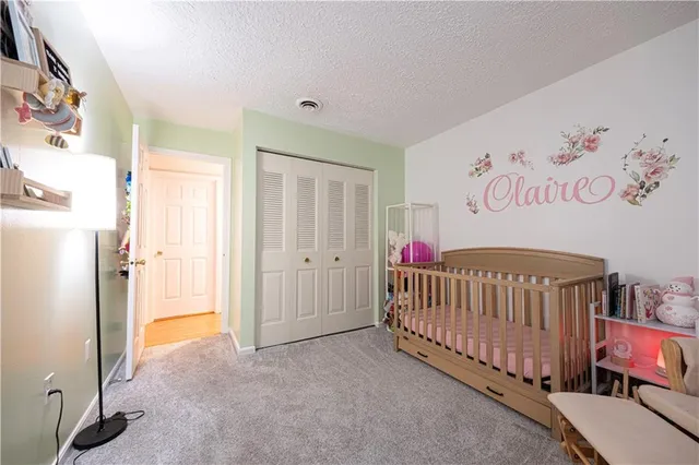 a bedroom with windows