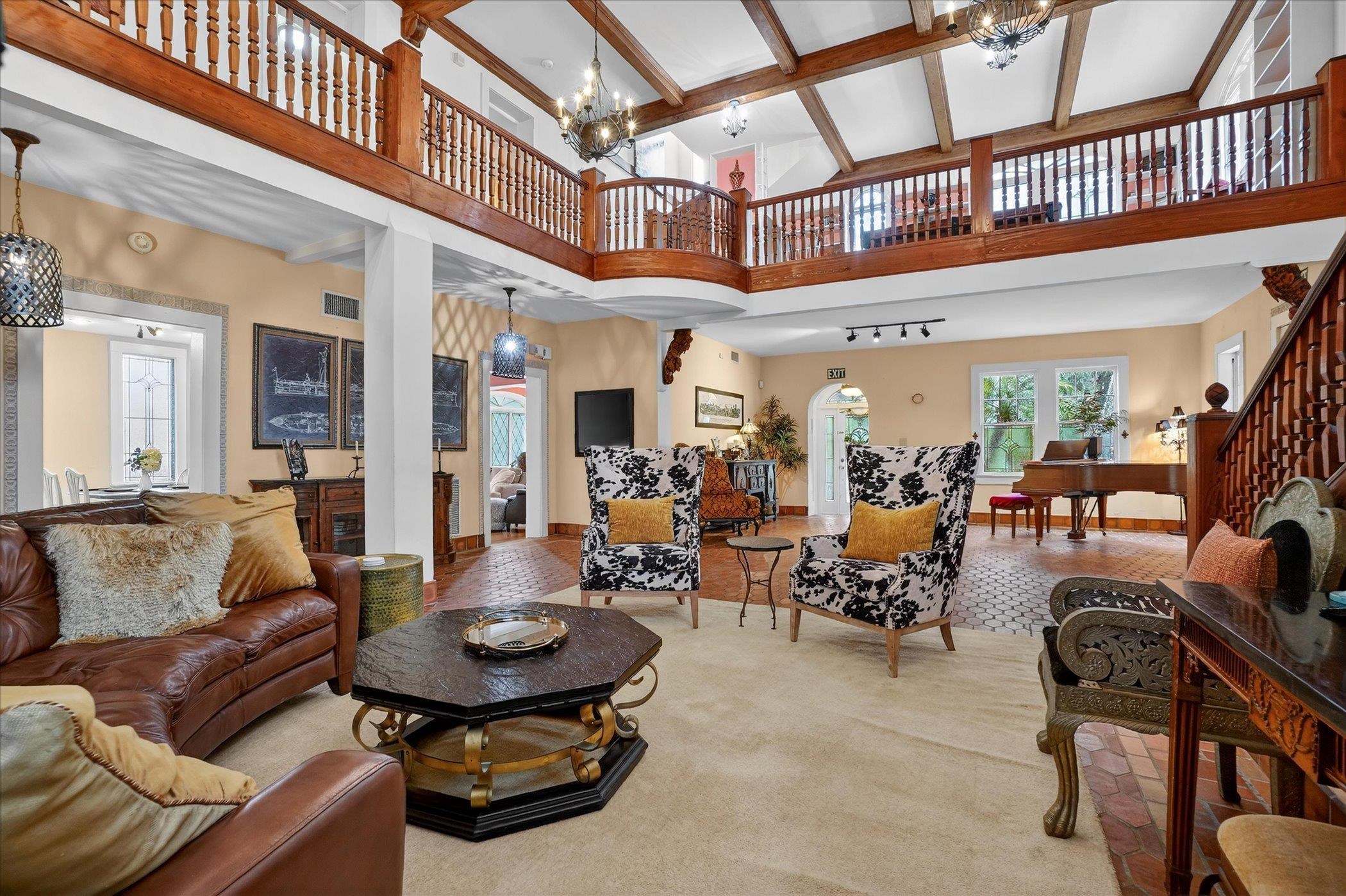 16 May Street St. Augustine, FL 32084 - Photo 16 of 85 Living room featuring suspended lighting and stairway