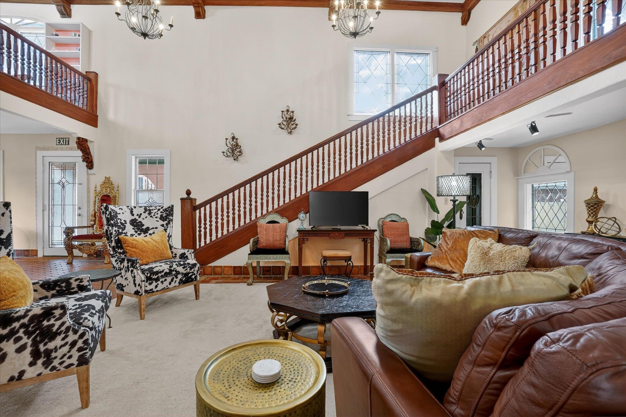 16 May Street St. Augustine, FL 32084 - Photo 18 of 85 Living room with a high ceiling and hanging lights