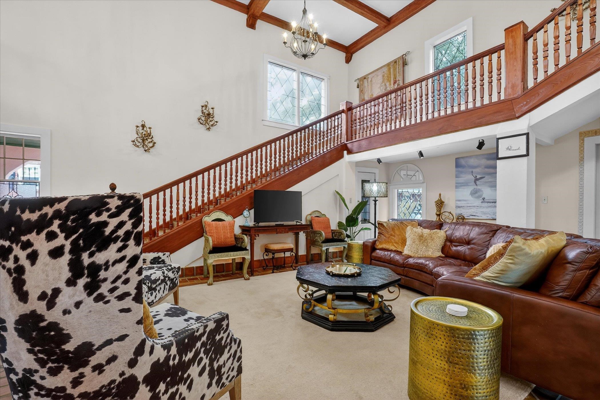 16 May Street St. Augustine, FL 32084 - Photo 22 of 85 Living room featuring a chandelier, carpet, and coffered ceiling