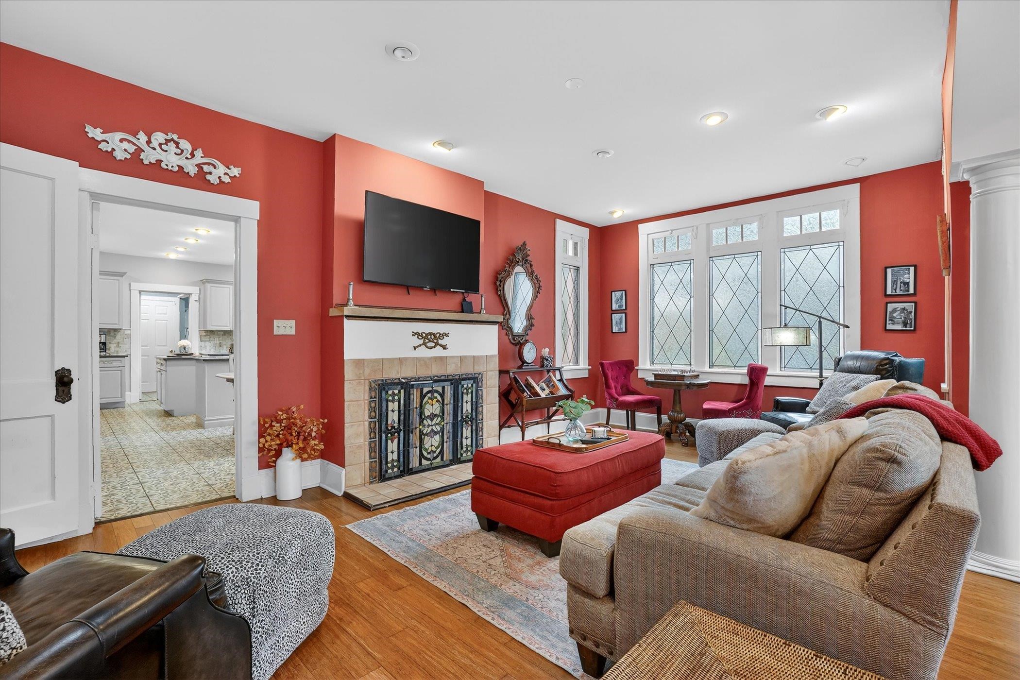 16 May Street St. Augustine, FL 32084 - Photo 23 of 85 Living room featuring wood finished floors and a tile fireplace