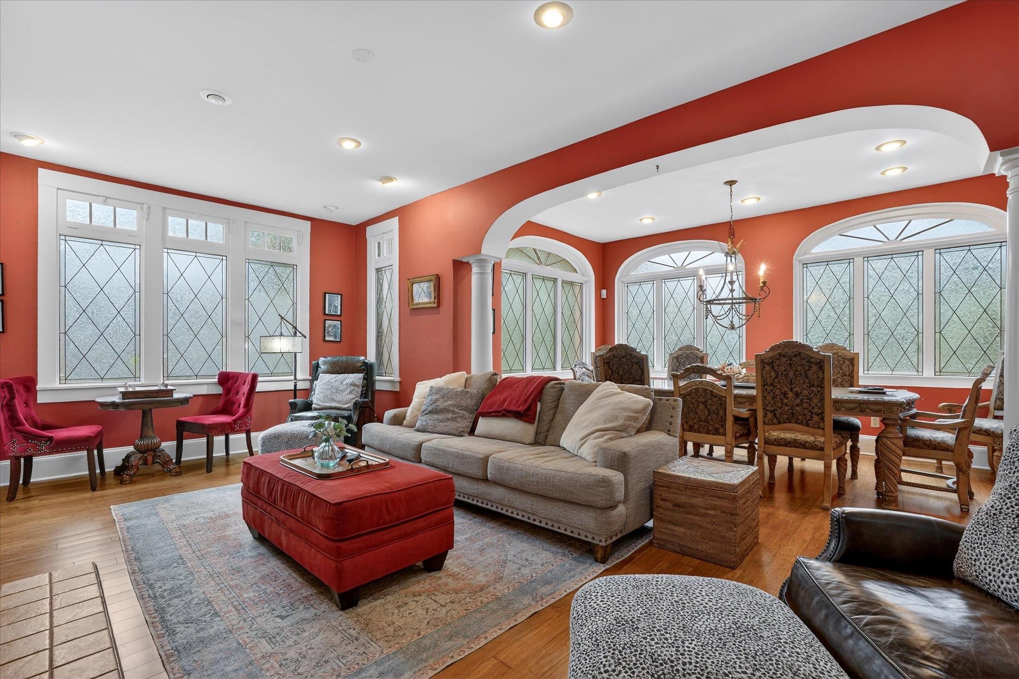 16 May Street St. Augustine, FL 32084 - Photo 48 of 85 Living area with arched walkways, decorative columns, hardwood / wood-style floors, healthy amount of natural light, and recessed lighting