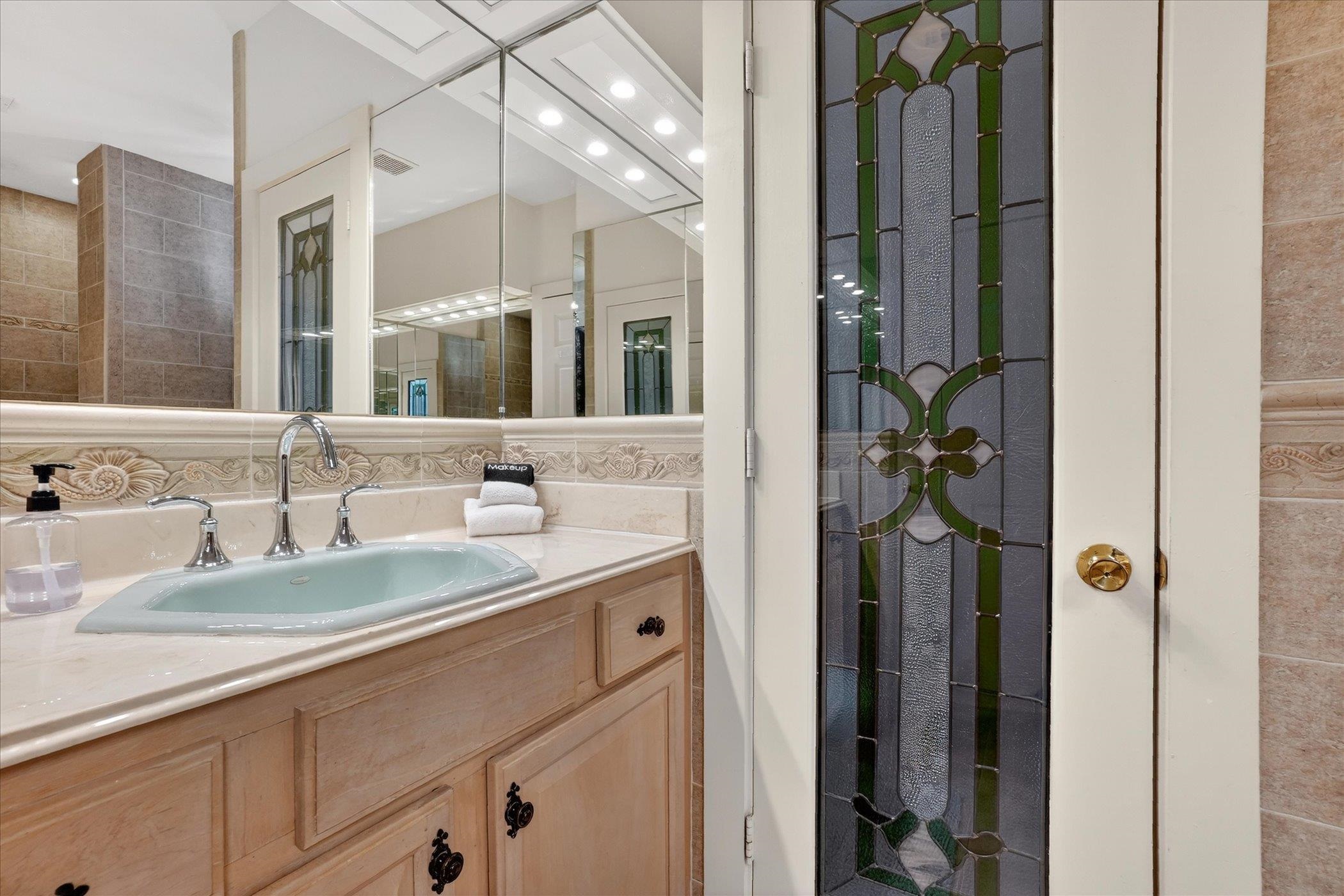 16 May Street St. Augustine, FL 32084 - Photo 54 of 85 Bathroom featuring vanity and a skylight