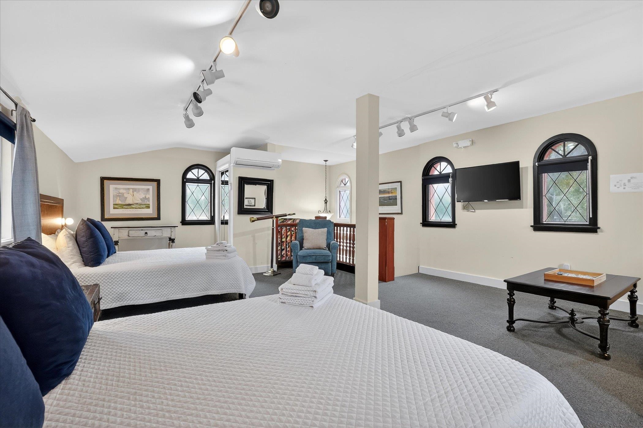 16 May Street St. Augustine, FL 32084 - Photo 57 of 85 Carpeted bedroom with rail lighting and multiple windows