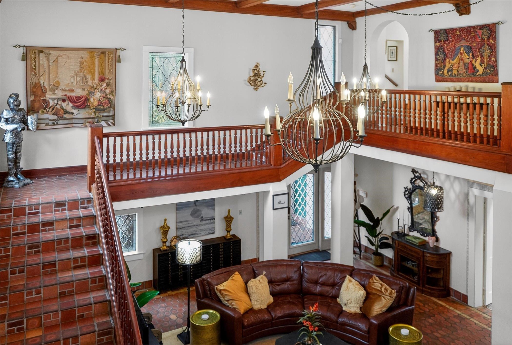 16 May Street St. Augustine, FL 32084 - Photo 65 of 85 Living area featuring plenty of natural light, a high ceiling, and a chandelier