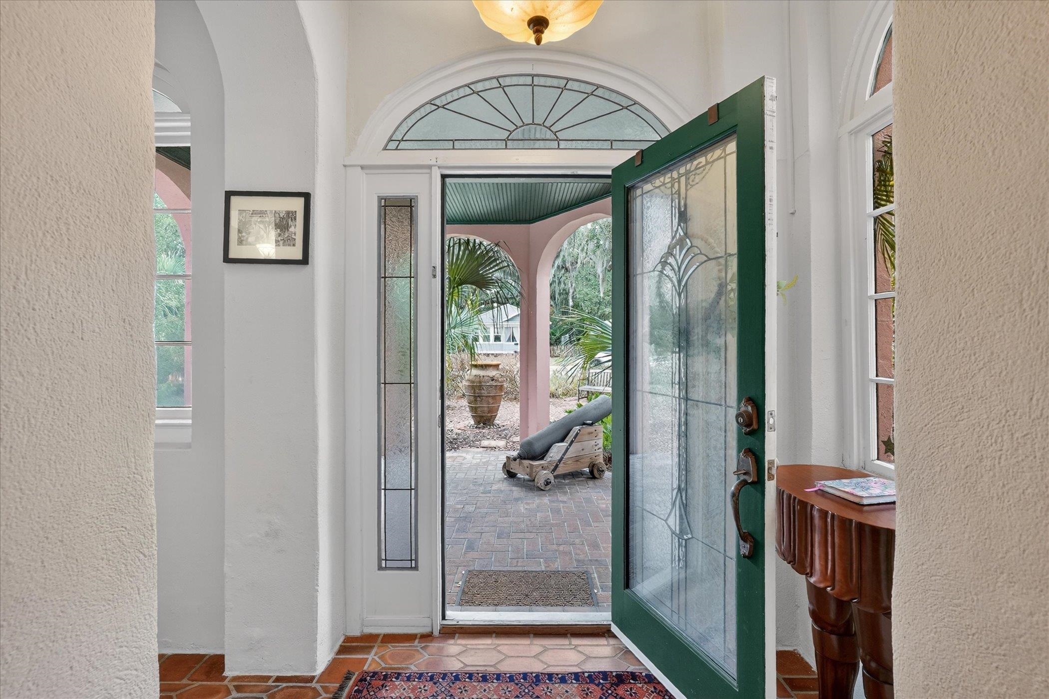 16 May Street St. Augustine, FL 32084 - Photo 9 of 85 Tiled entrance foyer with a textured wall and arched walkways