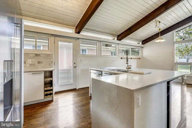 a kitchen with a sink and a refrigerator