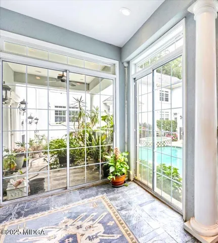 a bedroom with a bed and chair