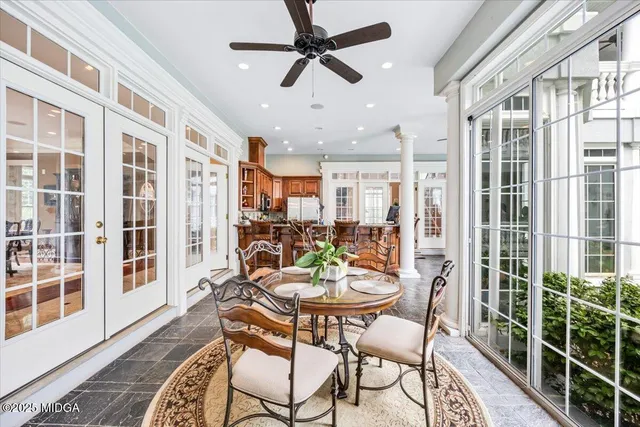 a living room with furniture a table and wooden floor