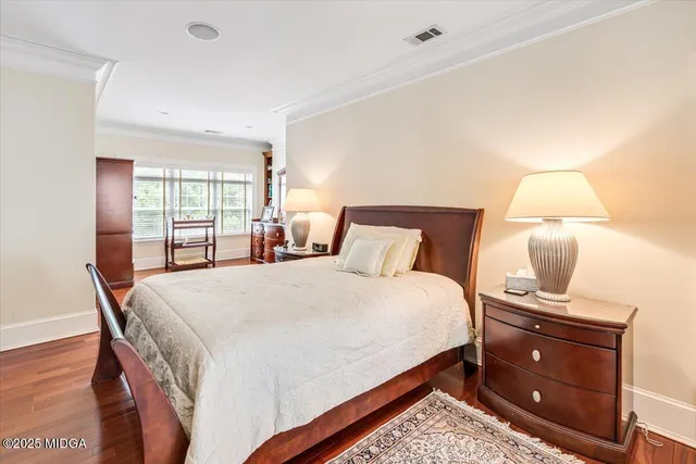 a bathroom with a bathtub a double vanity sink and mirror