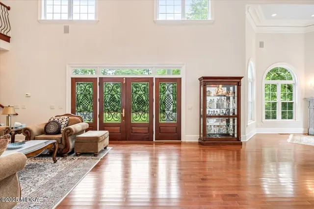 an aerial view of a house with a yard basket ball court and outdoor seating
