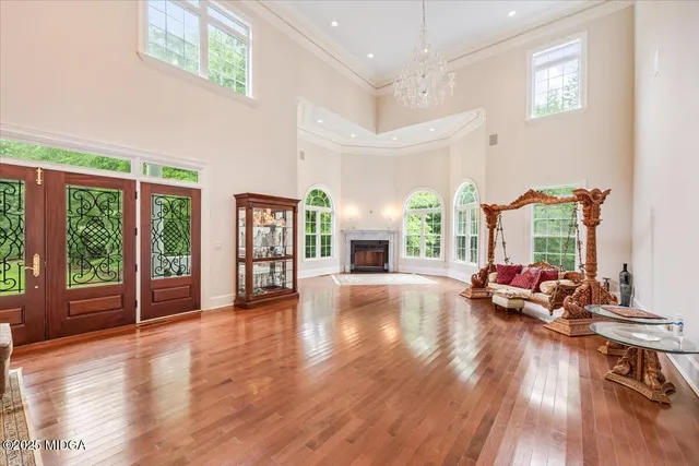 an aerial view of a house with swimming pool and garden