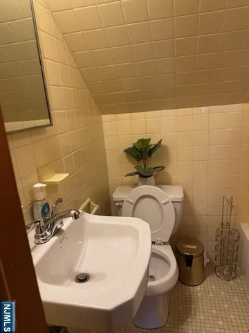 a bathroom with a toilet and a sink