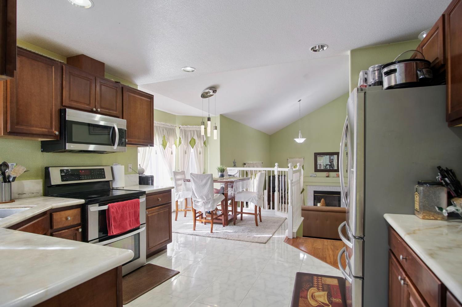 1568 Vía Del Pettoruto Gustine, CA 95322 - Photo 11 of 30 a living room with stainless steel appliances furniture a kitchen view and a refrigerator