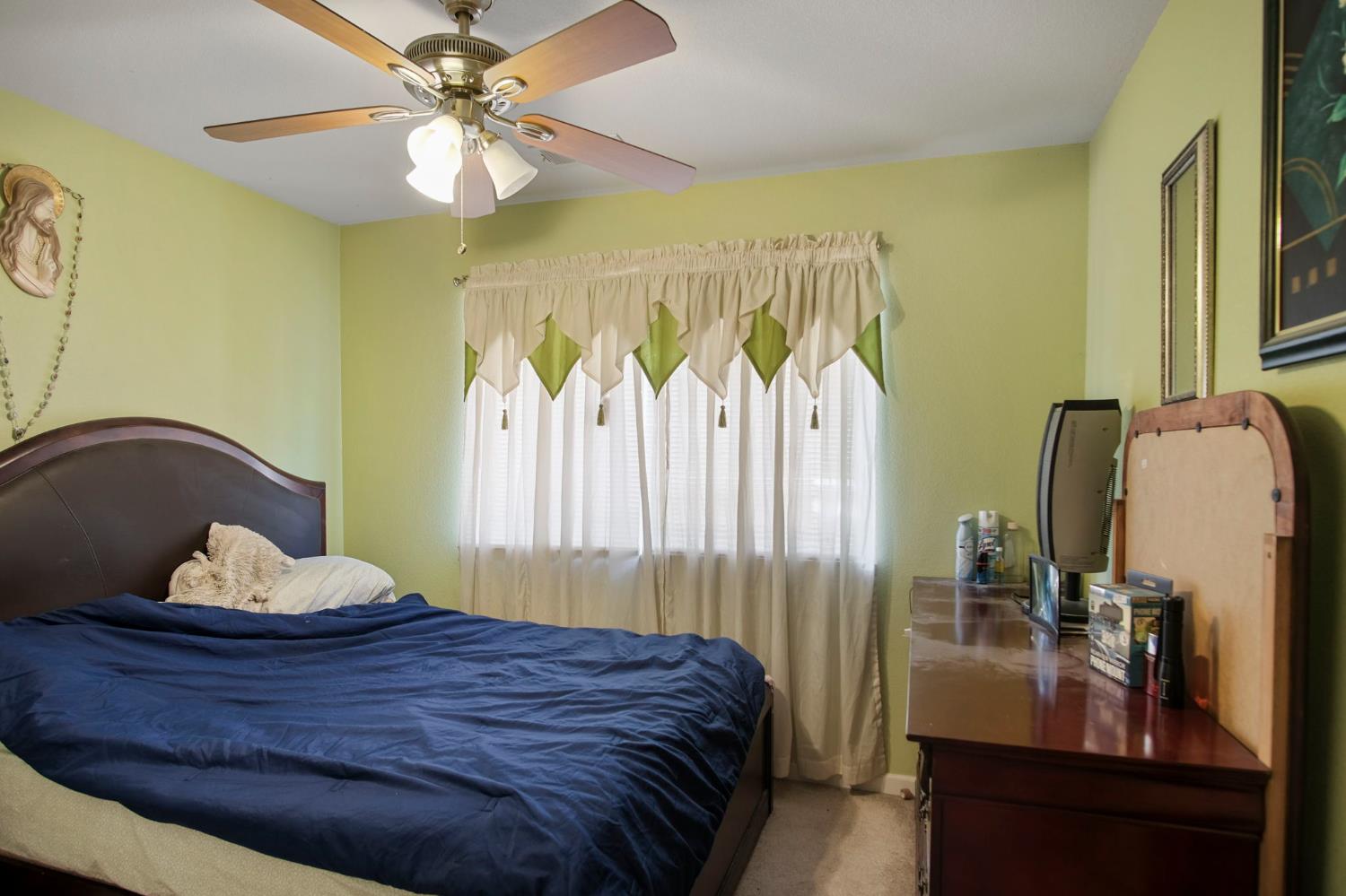 1568 Vía Del Pettoruto Gustine, CA 95322 - Photo 22 of 30 a bedroom with a bed and wooden floor