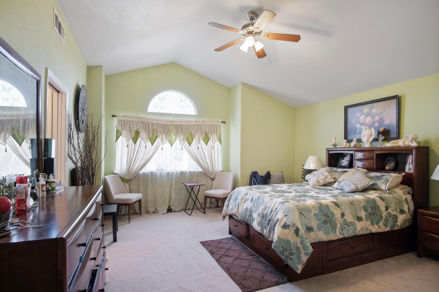 1568 Vía Del Pettoruto Gustine, CA 95322 - Photo 23 of 30 a bedroom with a bed a desk and chair