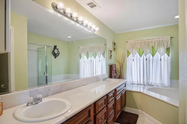 a backyard of a house with yard and outdoor seating