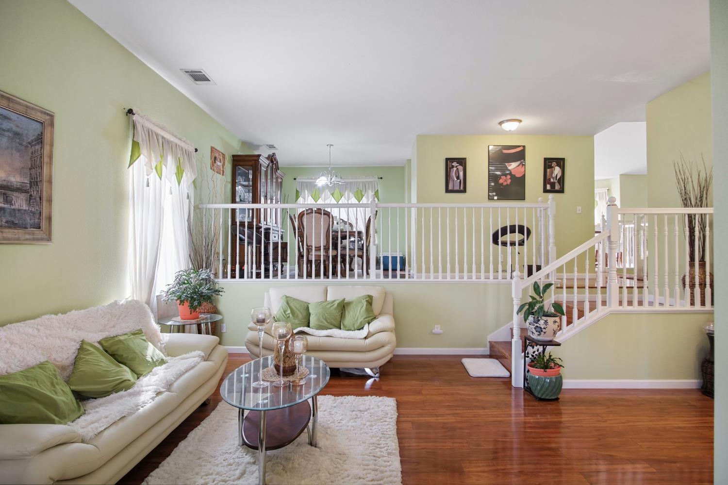 1568 Vía Del Pettoruto Gustine, CA 95322 - Photo 8 of 30 a living room with furniture and wooden floor