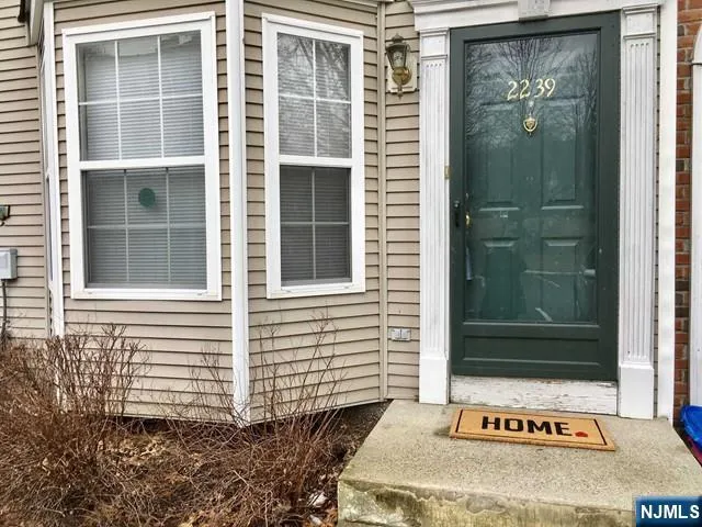 a front view of a house with a door and a window