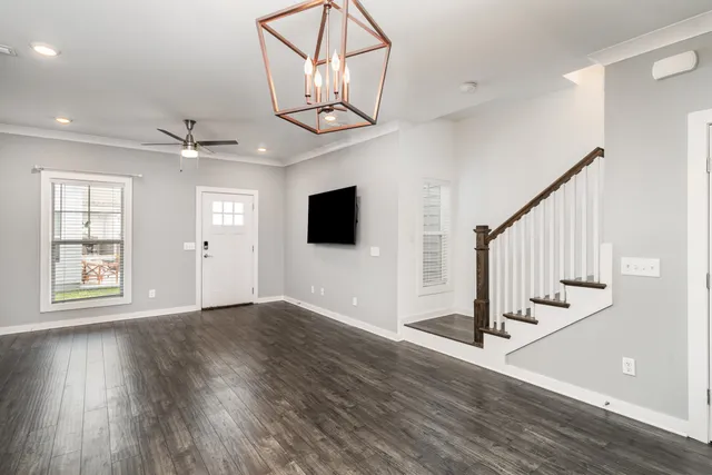 a view of kitchen with microwave and refrigerator
