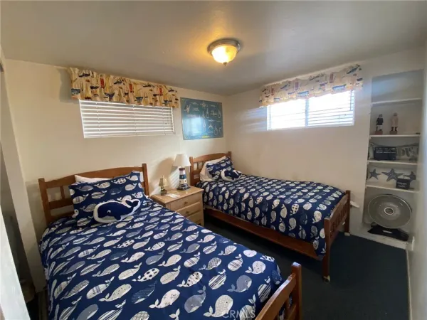 a bedroom with a bed and dresser
