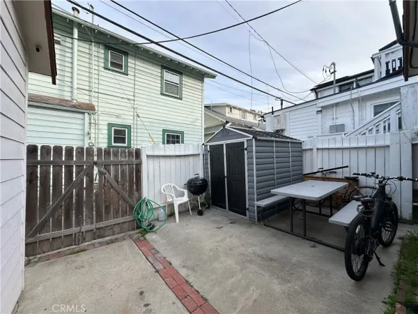 a view of a patio with a table and chairs