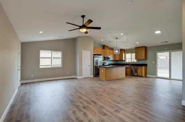 a view of a kitchen with a sink and a window