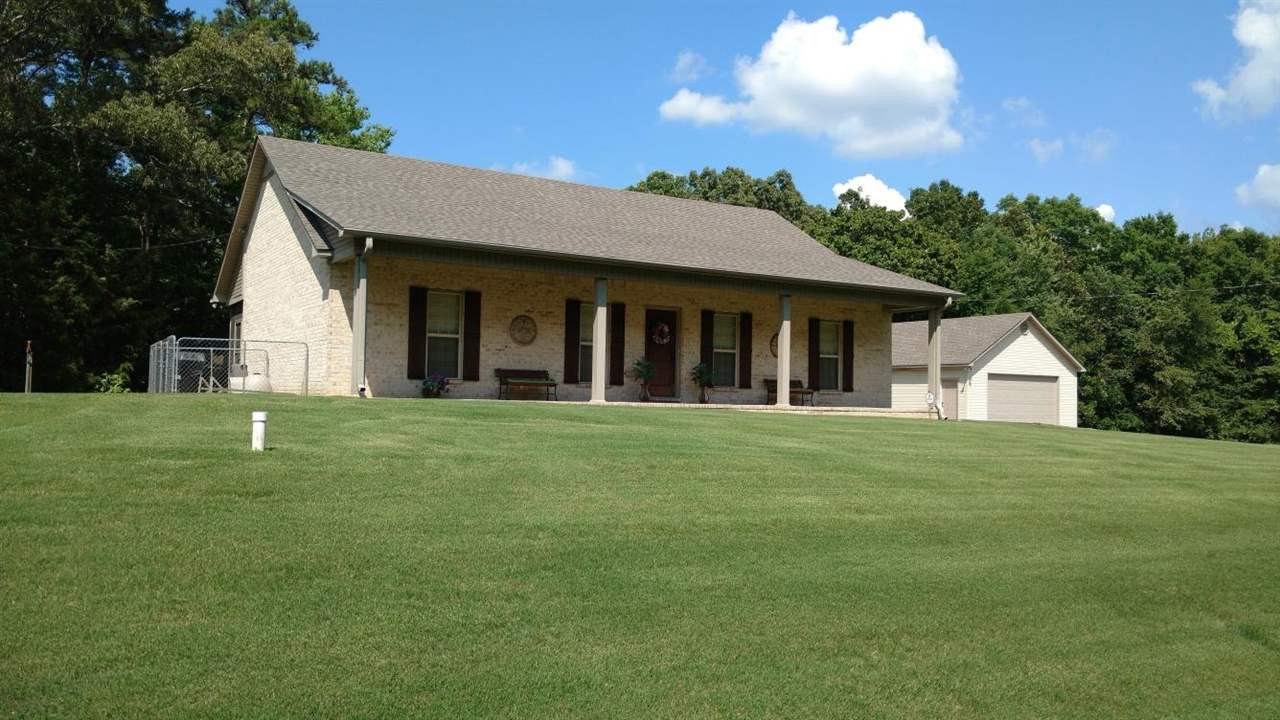 520 Pleasant Springs Road Henderson, TN 38340 - Photo 1 of 1 a view of a white house with a big yard and large trees