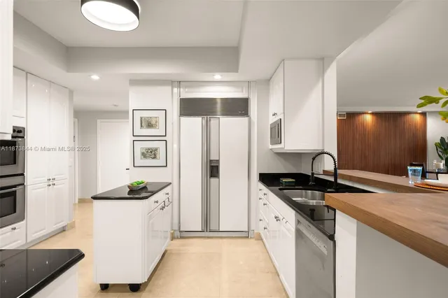 a kitchen with a sink stove and refrigerator