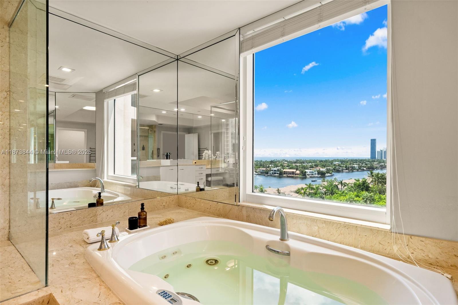 21200 Point Place, Unit 1102 Aventura, FL 33180 - Photo 18 of 41 a bathroom with a tub and sink