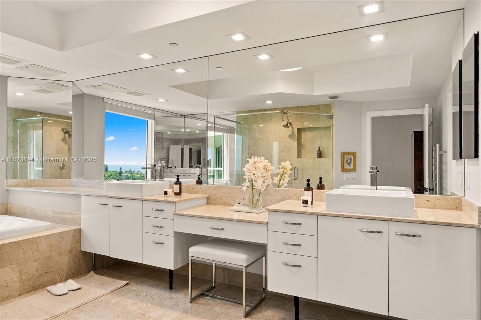 21200 Point Place, Unit 1102 Aventura, FL 33180 - Photo 19 of 41 a bathroom with a sink vanity and a mirror