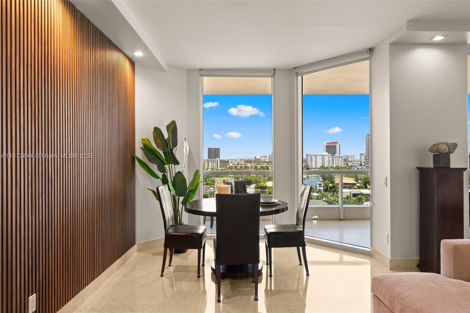 21200 Point Place, Unit 1102 Aventura, FL 33180 - Photo 2 of 41 a view of a dining room with furniture window and outside view