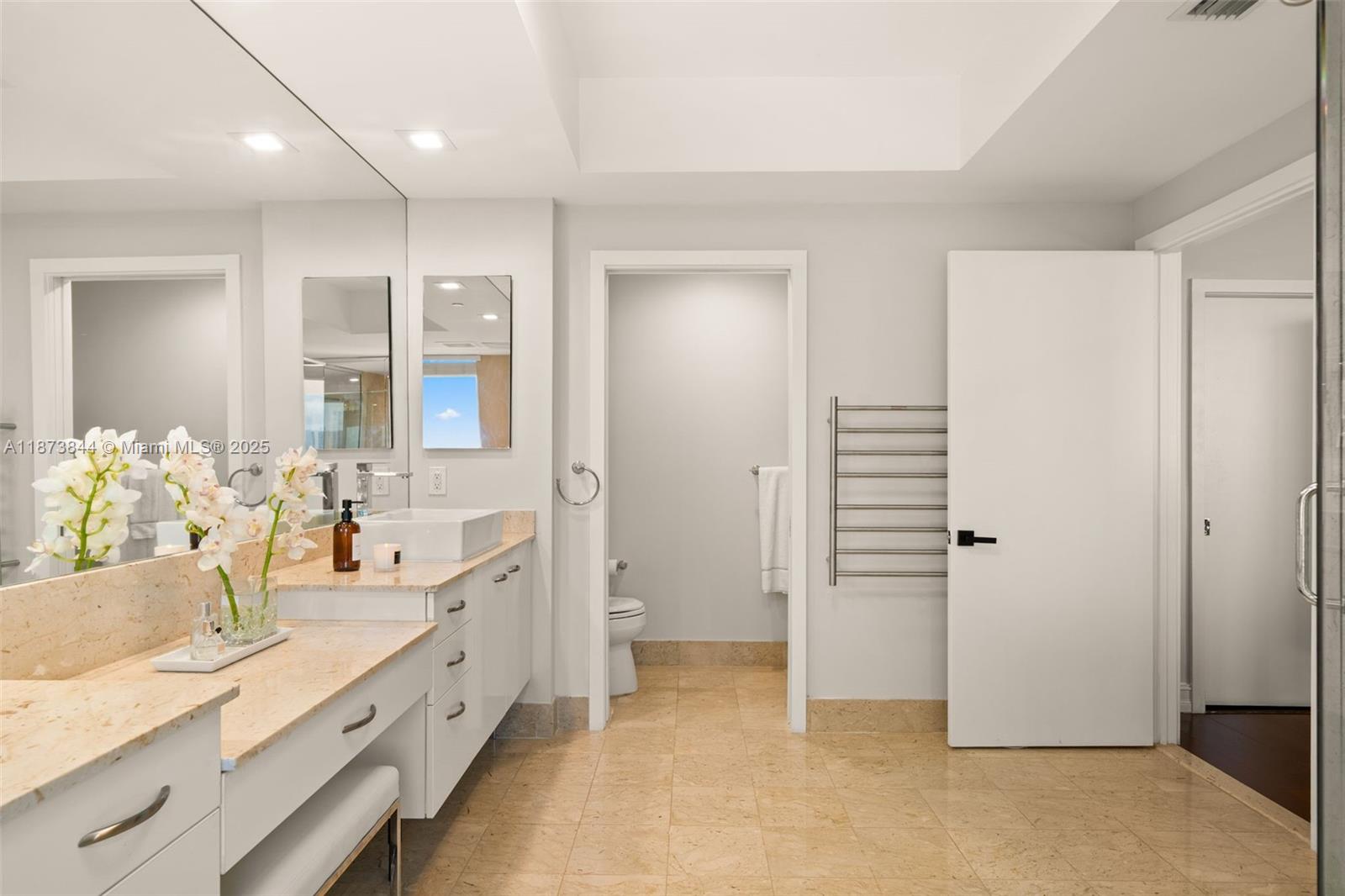 21200 Point Place, Unit 1102 Aventura, FL 33180 - Photo 21 of 41 a bathroom with a granite countertop sink and a mirror