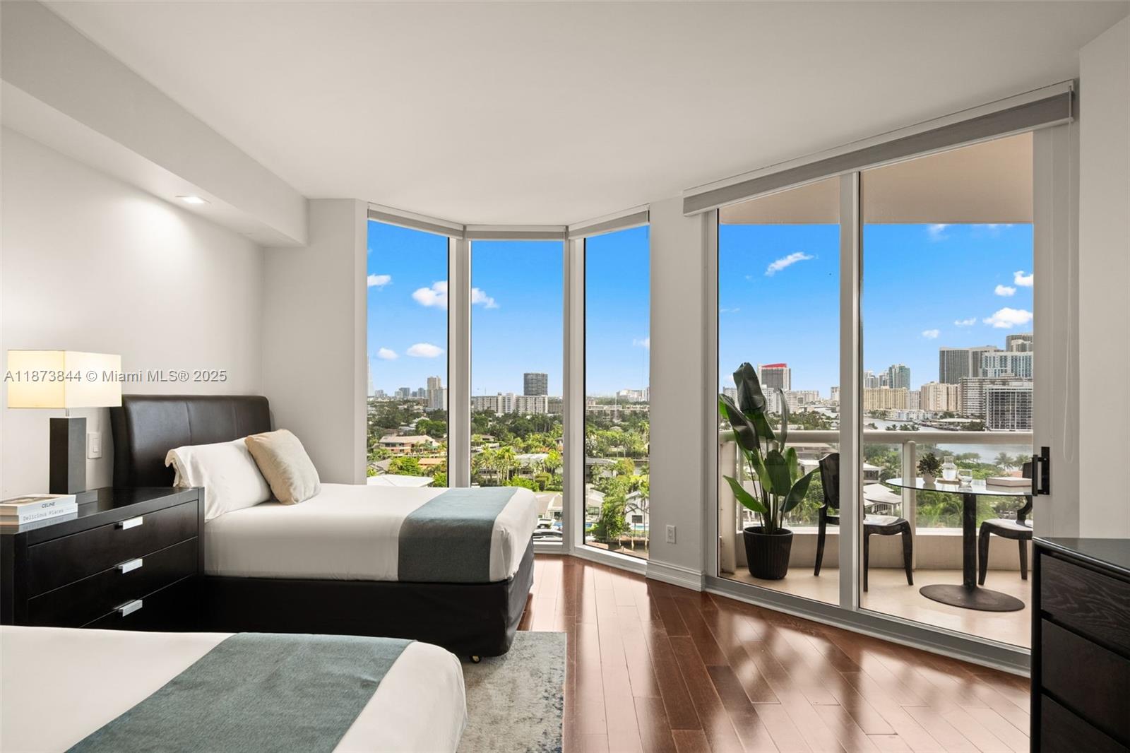 21200 Point Place, Unit 1102 Aventura, FL 33180 - Photo 24 of 41 a living room with furniture and a large window