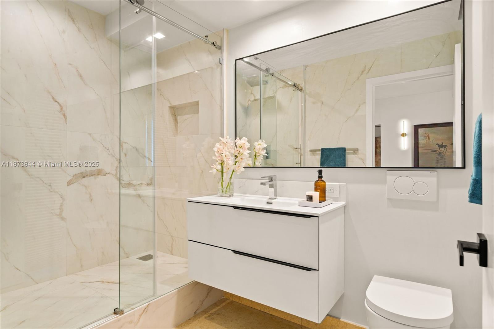 21200 Point Place, Unit 1102 Aventura, FL 33180 - Photo 27 of 41 a bathroom with a sink a toilet and shower