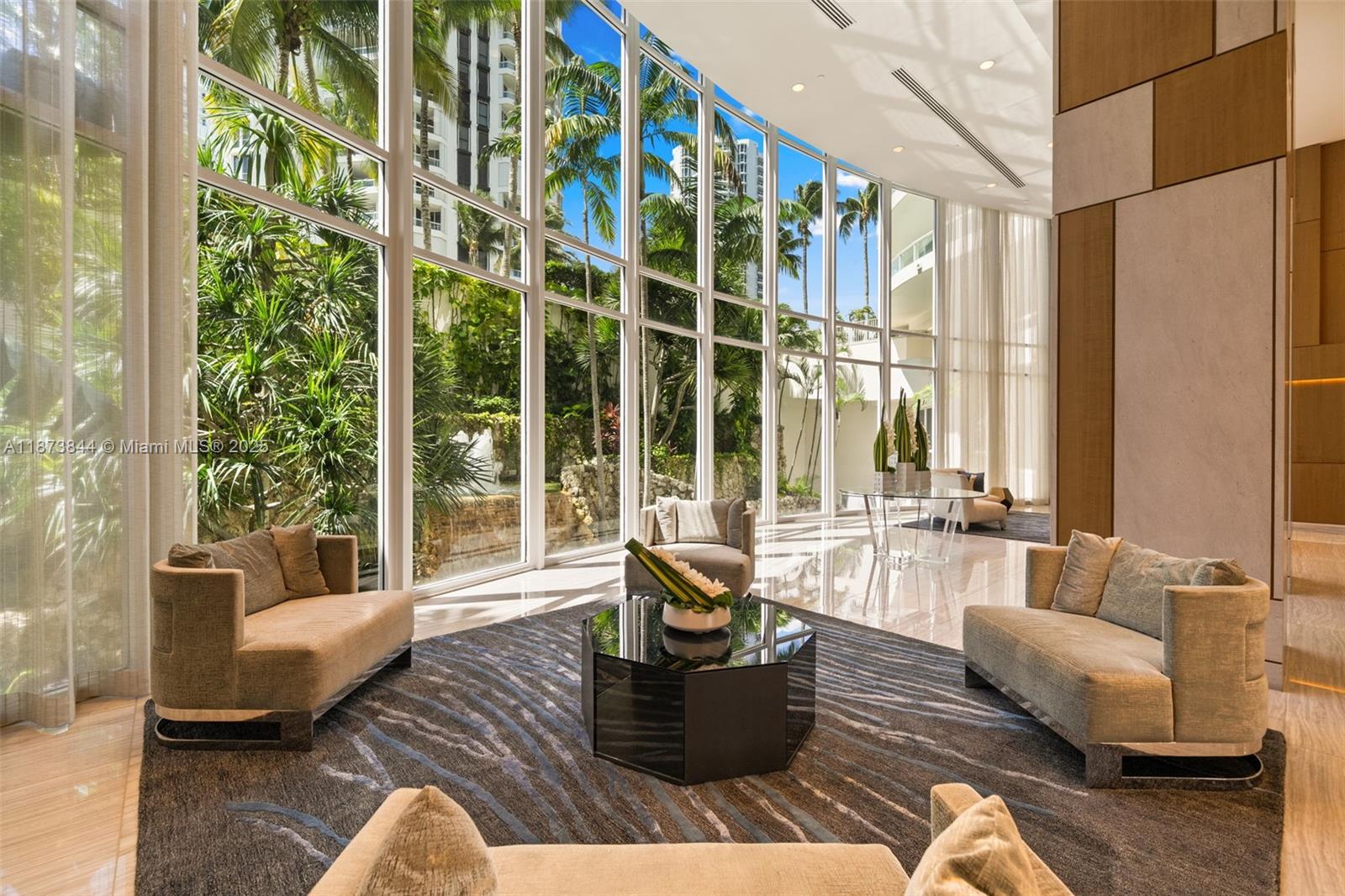 21200 Point Place, Unit 1102 Aventura, FL 33180 - Photo 32 of 41 a living room with furniture and a large window