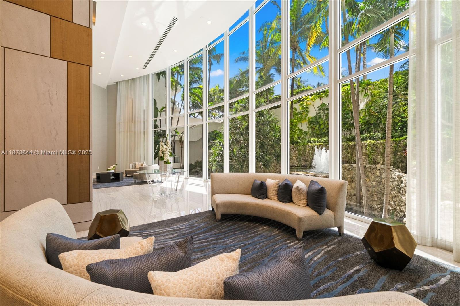 21200 Point Place, Unit 1102 Aventura, FL 33180 - Photo 33 of 41 a living room with furniture and a large window