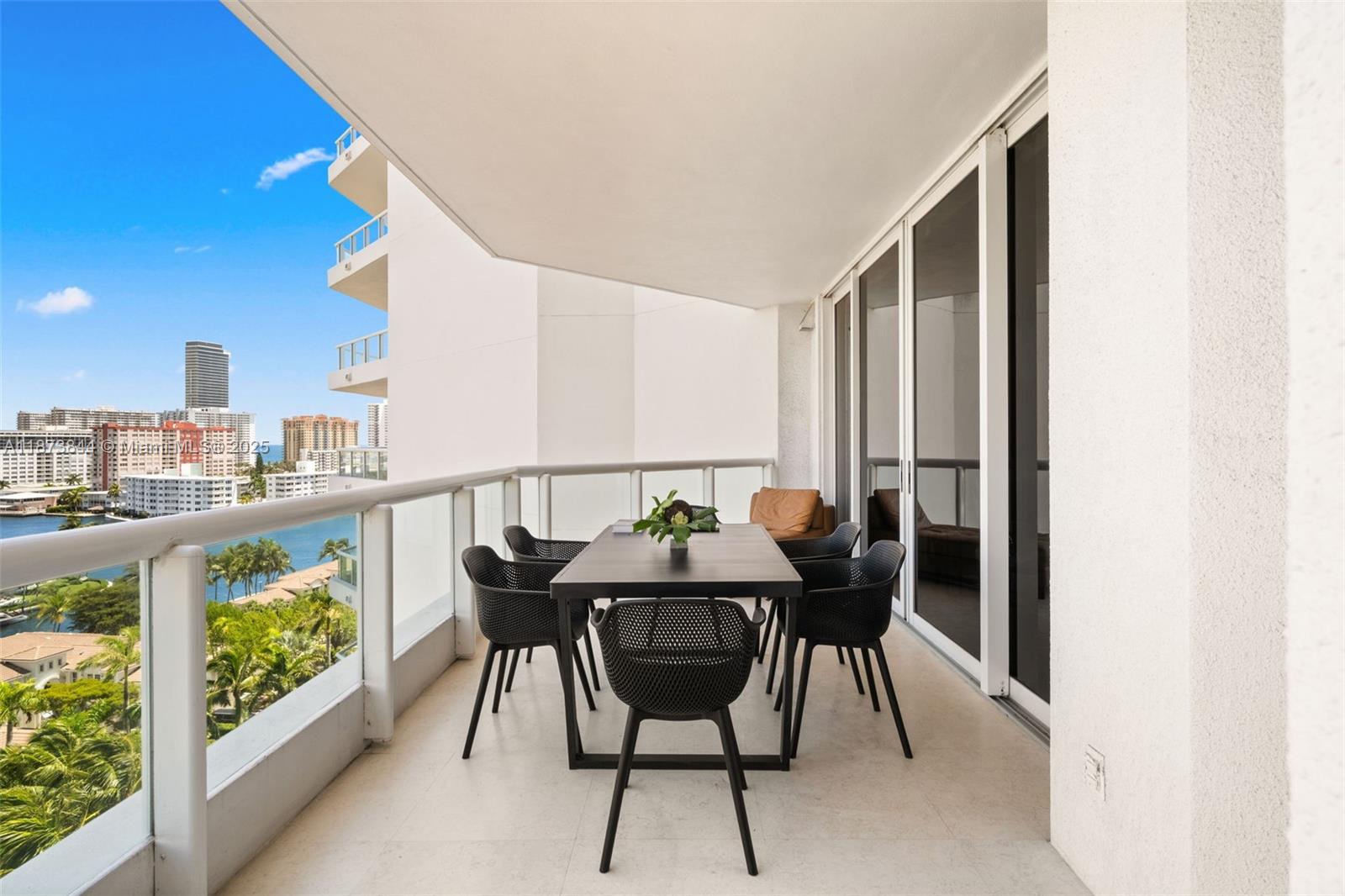 21200 Point Place, Unit 1102 Aventura, FL 33180 - Photo 10 of 41 a view of a chairs and table in the balcony