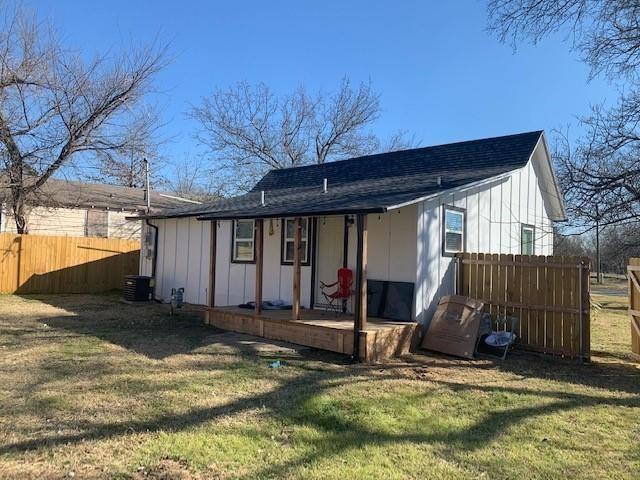 511 East Washington Street Denison, TX 75021 - Photo 10 of 12 Rear view of property featuring a shingled roof, a porch, and board and batten siding