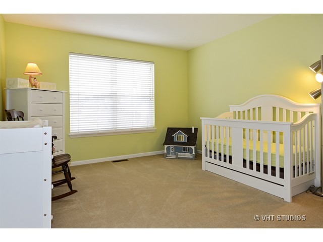 227 Grand Ridge Road, Unit 227 St. Charles, IL 60175 - Photo 7 of 10 a view of livingroom with furniture and staircase
