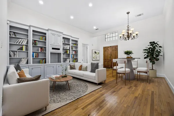 a living room with furniture and a potted plant