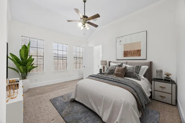 a spacious bedroom with a large bed and a window
