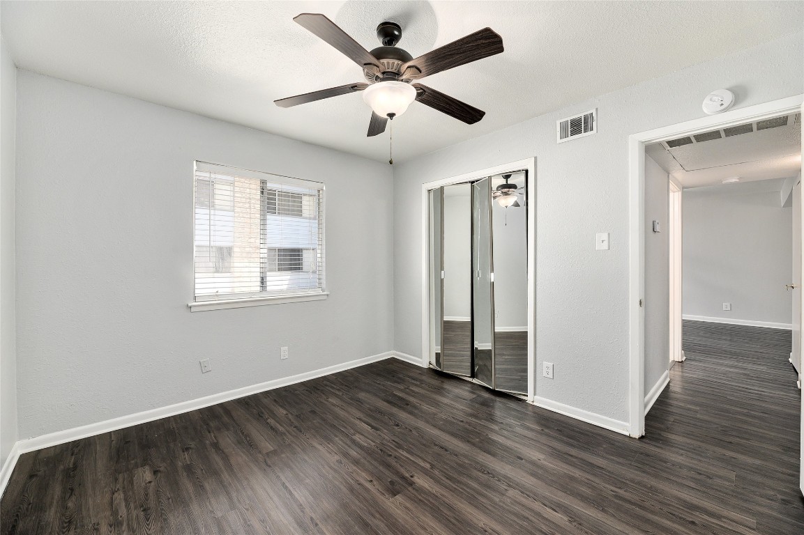 2408 Longview Street, Unit 113 Austin, TX 78705 - Photo 14 of 23 wooden floor in an empty room with a window