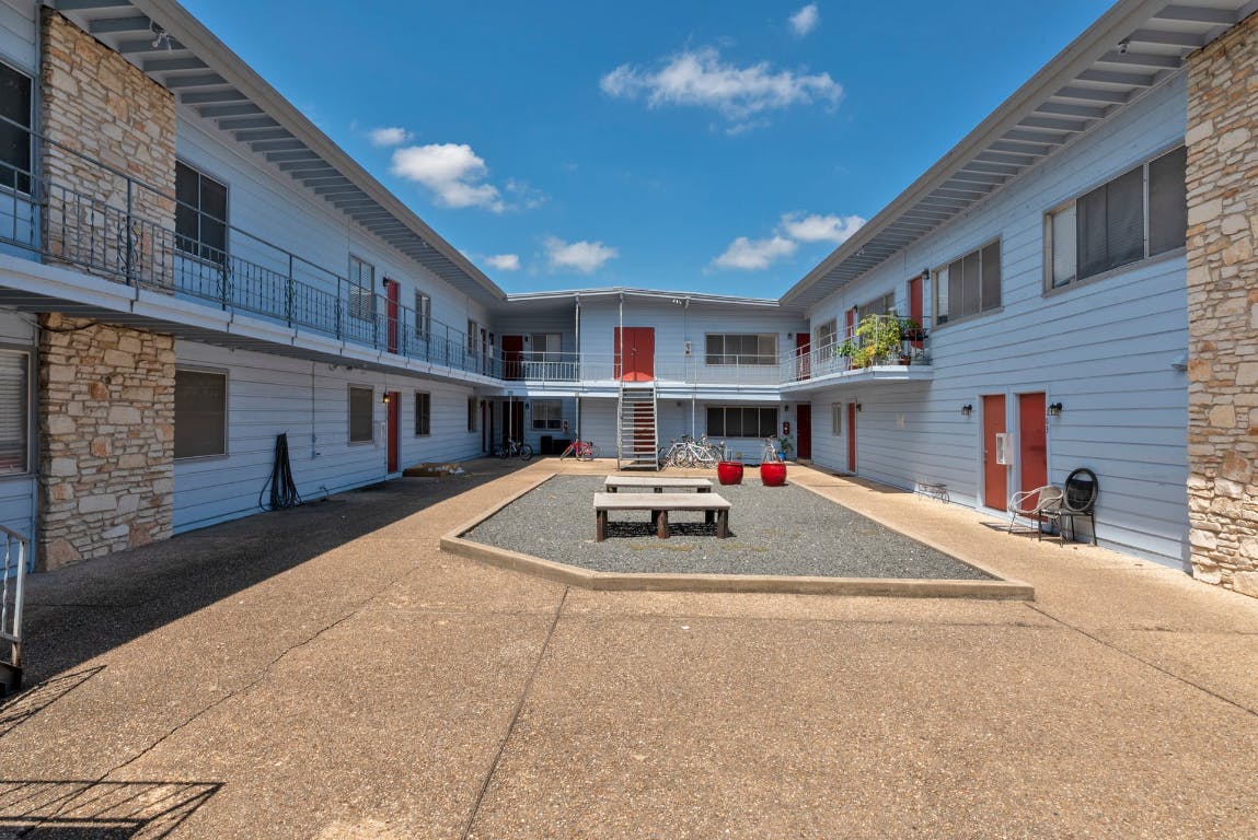 2408 Longview Street, Unit 113 Austin, TX 78705 - Photo 2 of 23 a car parked in front of building